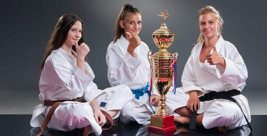 Martial Arts Lessons for Kids in Allen TX - Thumbs Up and Trophies with Sitting Girls
